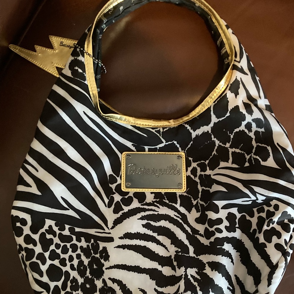 Betseyville By Betsey Johnson black & white patterned purse with gold outline